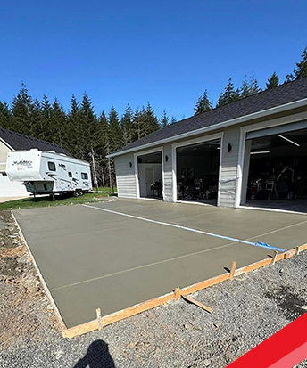 Final finished new concrete three-car driveway in Redmond